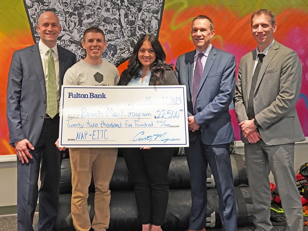 In the photo, left to right, are: Phil Smith, Regional Commercial Executive; Will Kiefer, Executive Director of Bench Mark Program; Christie Eachus, Market Manager; Mark Katkovcin, Consumer Sales Manager; and Josh Griffith, Commercial Banking Team Leader.