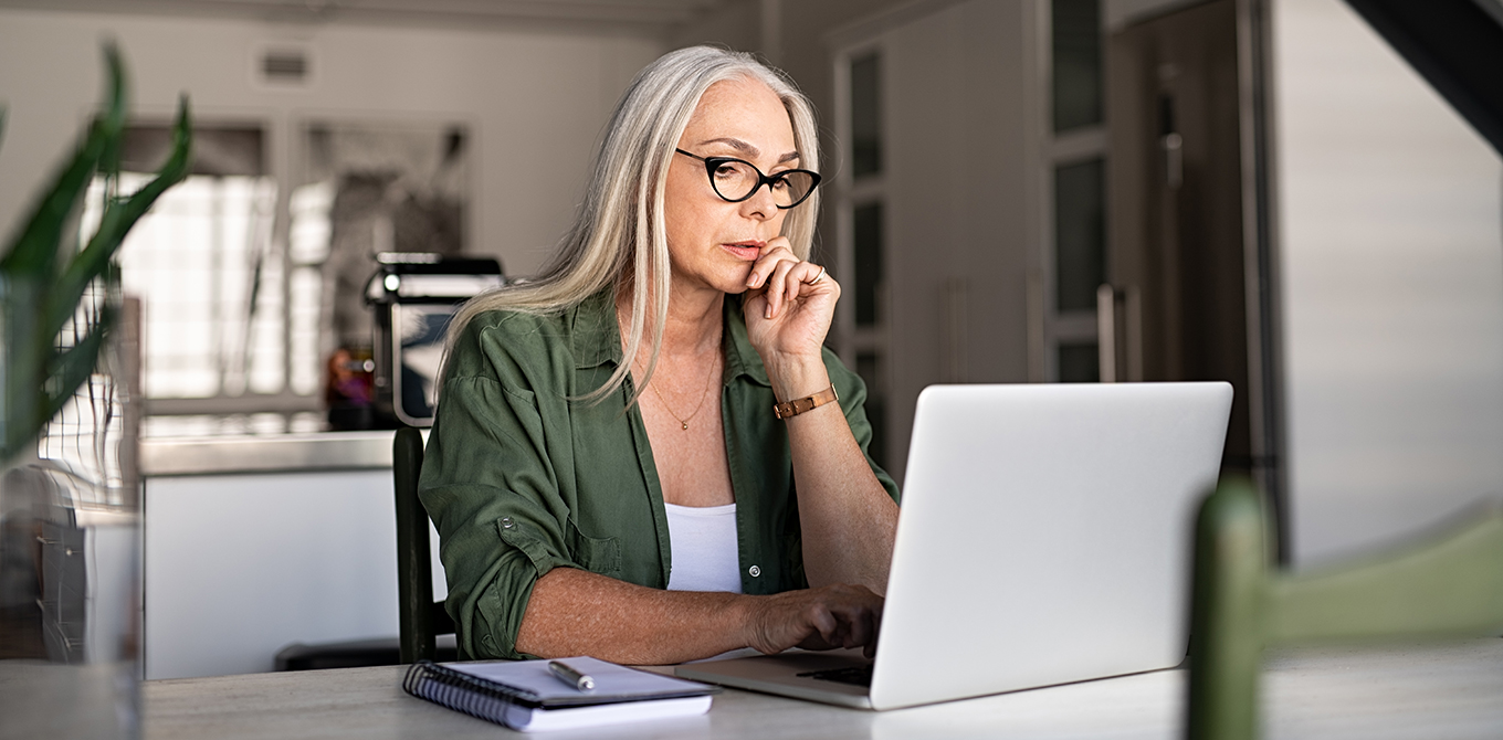 Senior woman looking at laptop